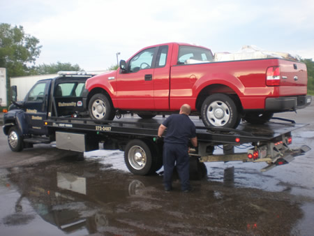 Ford F150 loaded up on the tow truck