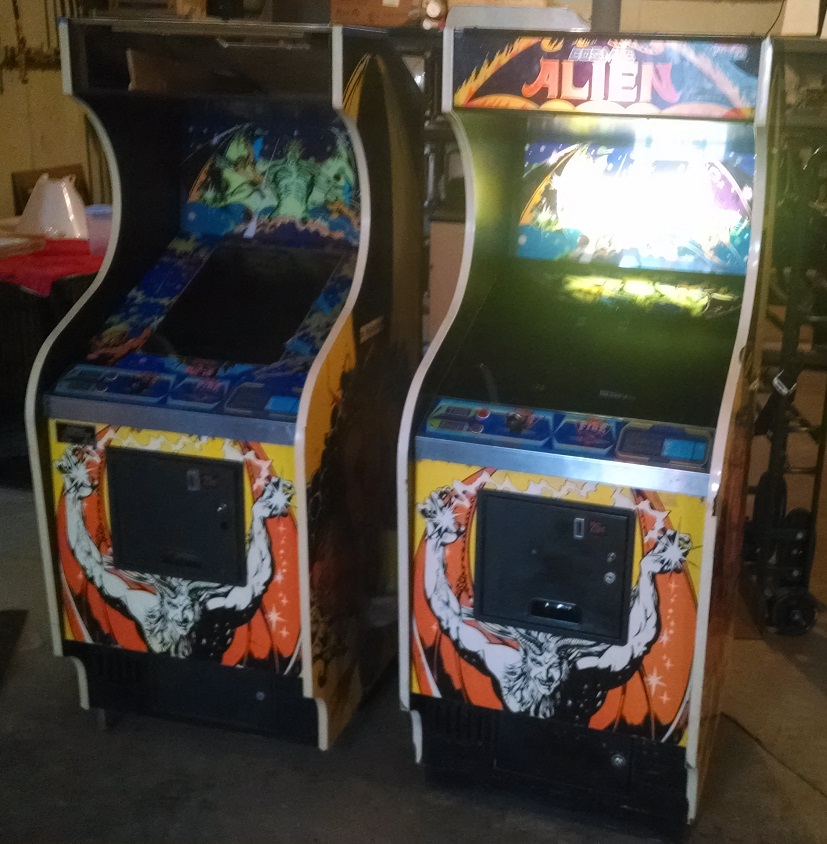 Two Cosmic Alien arcade games, side by side