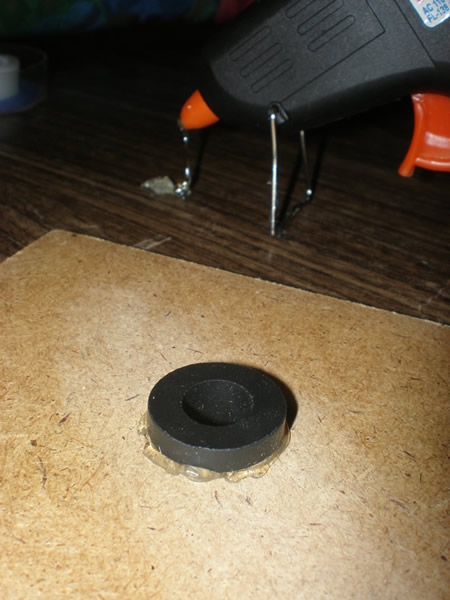 Hot gluing the rubber grommet