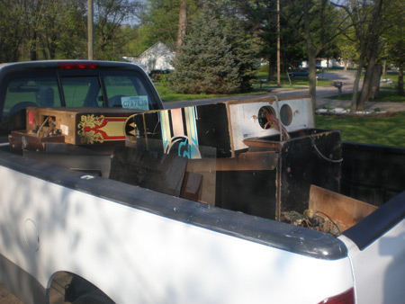 Two pinball machines in the truck bed