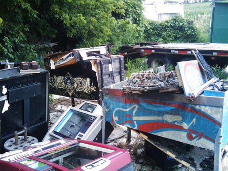 Water damaged pinballs machines outside